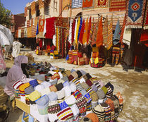 Woman selling knit hats in a market, Marrakesh, Morocco von Panoramic Images