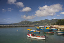 Boats with a pier in the background, Bel Ombre, Mahe Island, Seychelles by Panoramic Images