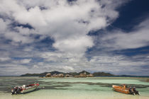 Fishing boats on the coast with buildings in the background by Panoramic Images