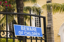 Beware of Children sign on a gate by Panoramic Images