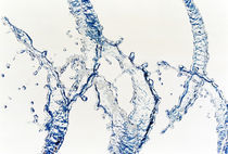 Close up of water bubbles zigzag across white background by Panoramic Images