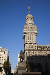 Buildings in a city, Salvo Palace, Plaza Independencia, Montevideo, Uruguay by Panoramic Images