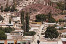 High angle view of town surrounded by hills by Panoramic Images