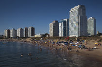 Tourists on the beach by Panoramic Images