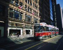 Cable car moving on a road, Toronto, Ontario, Canada by Panoramic Images