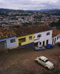 High angle view of cars parked in front of houses in a city by Panoramic Images