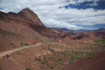 Road passing through mountains by Panoramic Images