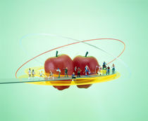 Small figures standing on circular yellow catwalk  by Panoramic Images
