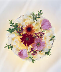 Close up of a clear globe filled with a multi colored bouquet by Panoramic Images