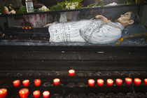 Burning candles at the statue of Pere Laval, Port Louis, Mauritius von Panoramic Images