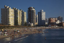 Tourists enjoying on the beach by Panoramic Images