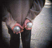 Mid section view of a man holding boules, Boule game, Paris, France by Panoramic Images