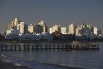 Pier and buildings at the seaside by Panoramic Images