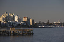 Pier and buildings at the seaside by Panoramic Images