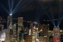 Laser show over city at night, Hong Kong, China.