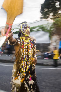 Man dressed as a Native American in the Port of Spain carnival in Trinidad. by Tom Hanslien
