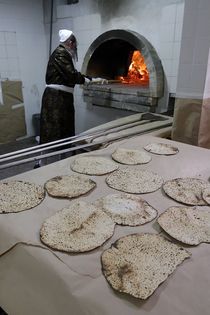 Matzot  Baking on Passover eve by Hanan Isachar