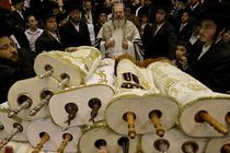Simchat Torah celebration, the Rebbe with the Torah scrolls by Hanan Isachar