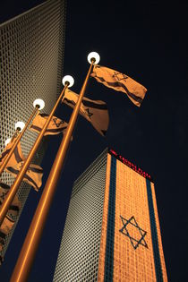 Tel Aviv, an illuminated Israeli flag at Azrieli Center by Hanan Isachar