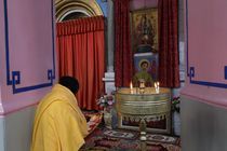 Jerusalem, a prayer at the Ethiopian Church von Hanan Isachar