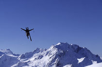 Skier flying through the air by Ross Woodhall