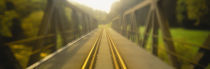 Railroad tracks passing through a bridge, Germany by Panoramic Images