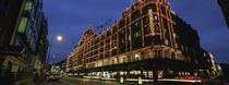 Low angle view of buildings lit up at night, Harrods, London, England von Panoramic Images