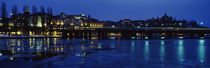 Buildings in a city lit up at night, Sodermalm, Slussplan, Stockholm, Sweden by Panoramic Images