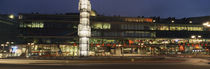 Buildings in a city lit up at dusk, Sergels Torg, Stockholm, Sweden by Panoramic Images