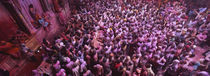 High angle view of people celebrating holi, Braj, Mathura, Uttar Pradesh, India von Panoramic Images