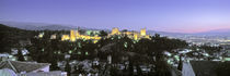 High angle view of a castle lit up at dusk, Alhambra, Granada, Andalusia, Spain von Panoramic Images