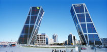 Low angle view of skyscrapers in a city, Puerta de Europa, Madrid, Spain by Panoramic Images