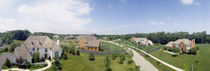 High angle view of houses on a field by Panoramic Images
