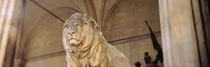Germany, Munich, Lion sculpture in front of a building von Panoramic Images