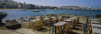 Tables and chairs in a cafe, Greece by Panoramic Images