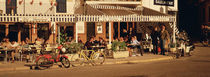 Tourists sitting in a cafe, Sitges Beach, Catalonia, Spain by Panoramic Images