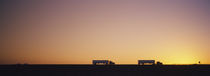 Silhouette of two trucks moving on a highway, Interstate 5, California, USA von Panoramic Images