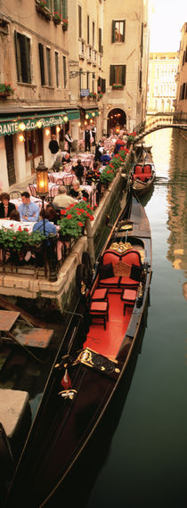 Gondolas moored outside of a cafe, Venice, Italy von Panoramic Images