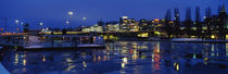 Buildings in a city lit up at night, Sodermalm, Slussplan, Stockholm, Sweden by Panoramic Images