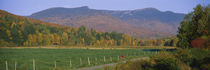 Woman cycling on a road, Stowe, Vermont, USA von Panoramic Images