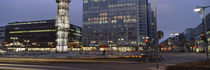 Buildings in a city lit up at dusk, Sergels Torg, Stockholm, Sweden by Panoramic Images