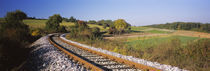 Railroad track passing through a landscape, Germany by Panoramic Images