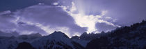 Switzerland, Canton Glarus, View of clouds over snow covered peaks von Panoramic Images