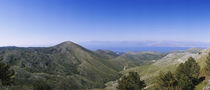 Mountain range with a sea in the background, Corfu, Ionian Islands, Greece by Panoramic Images
