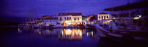 Greece, Cephalonia, Light illuminated on harbor and outdoors cafe von Panoramic Images