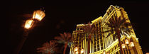 Low angle view of a hotel lit up at night, The Strip, Las Vegas, Nevada, USA von Panoramic Images