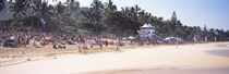 Tourists on the beach, North Shore, Oahu, Hawaii, USA by Panoramic Images