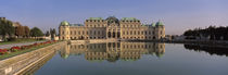  Belvedere Palace, View of a manmade lake outside a vintage building von Panoramic Images