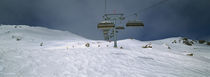 Ski lift over a polar landscape, Lech ski area, Austria by Panoramic Images