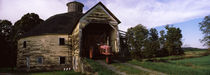 Tractor parked inside of a round barn, Vermont, USA by Panoramic Images